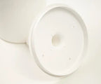Close up shot of toilet brush set inside lid