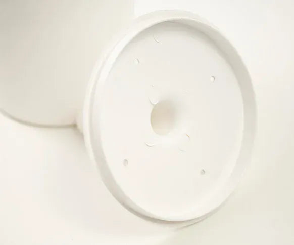 Close up shot of toilet brush set inside lid