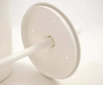 Close up shot of toilet brush set inside lid