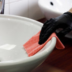 red cleaning cloth cleaning sink areas