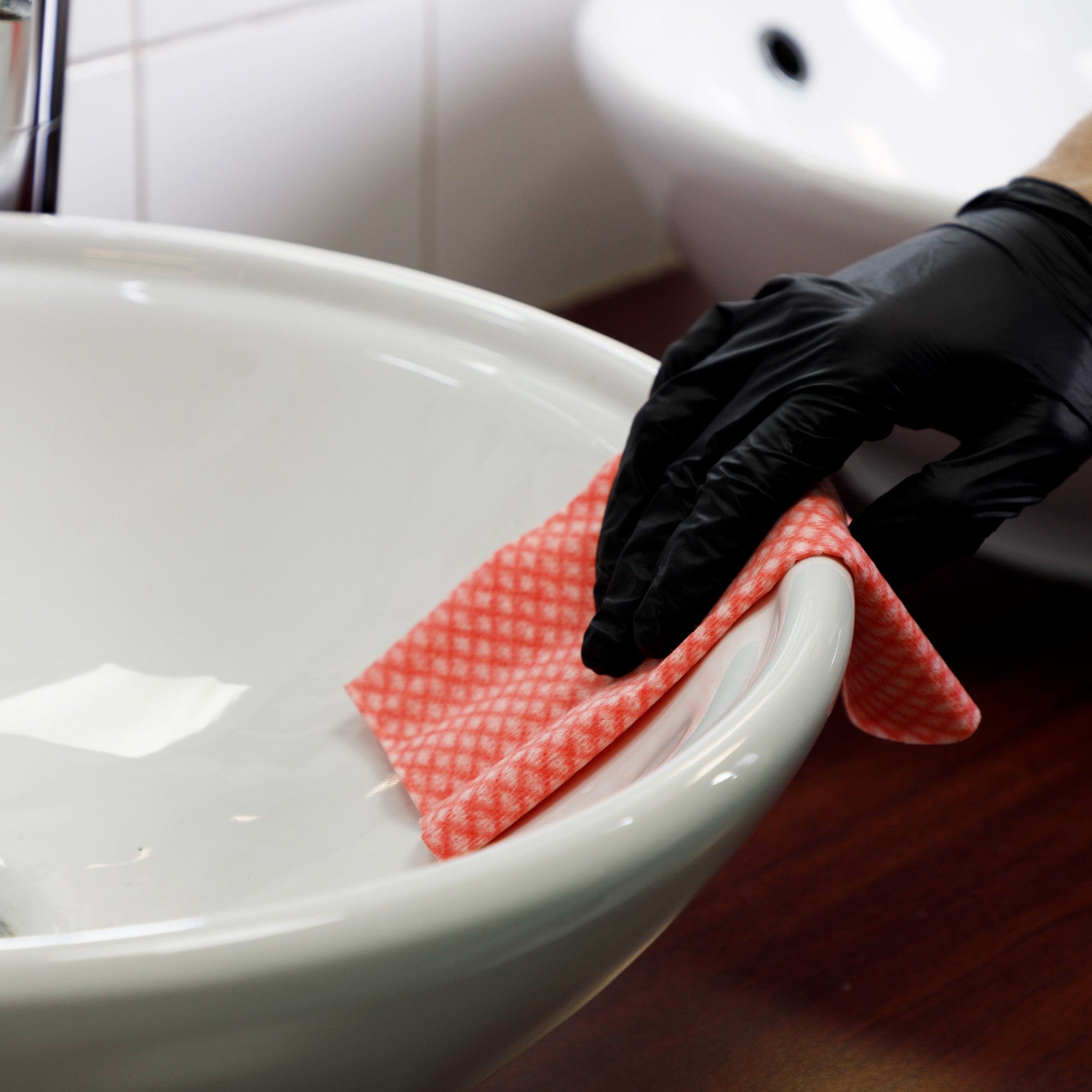 red cleaning cloth cleaning sink areas