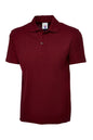 Maroon polo shirt on a white background
