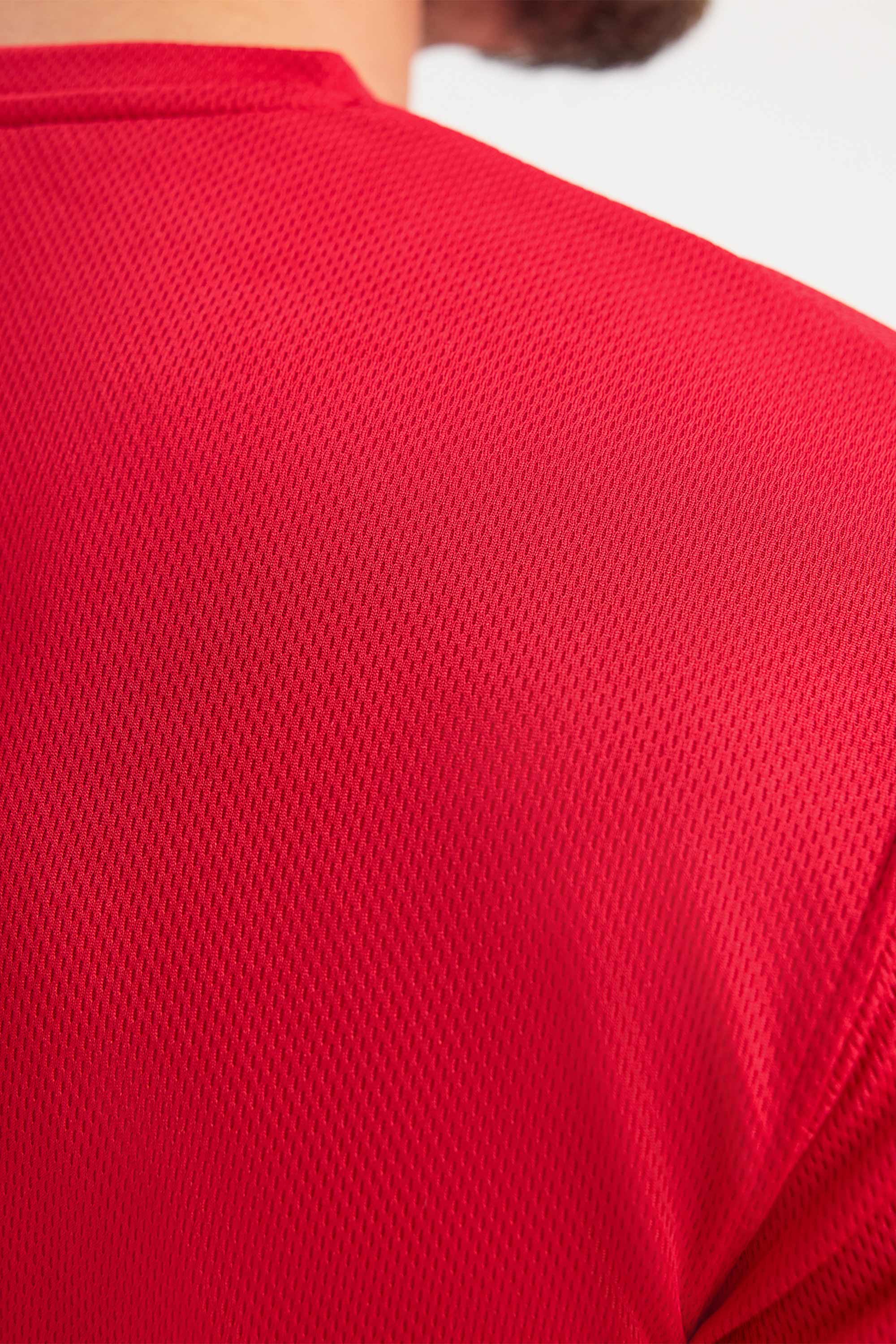 Close-up of a red textured shirt on a white background