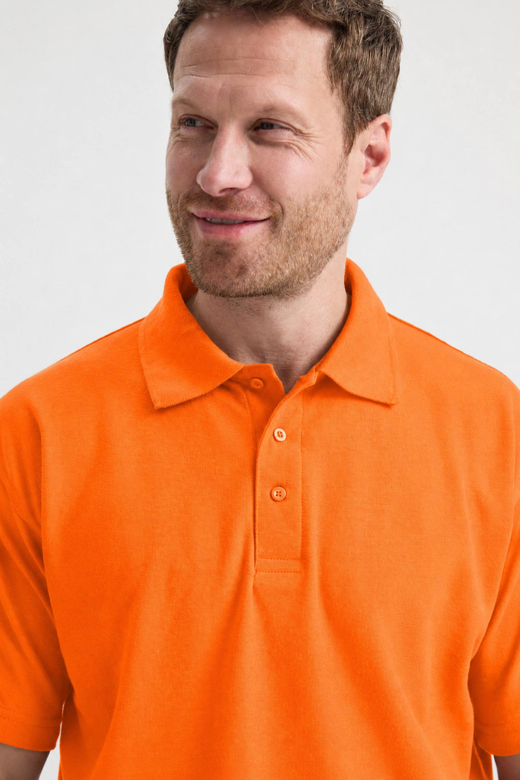 Man wearing an orange polo shirt against a white background