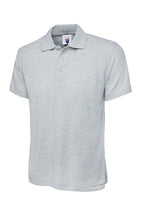 Grey polo shirt with a brand logo on a white background