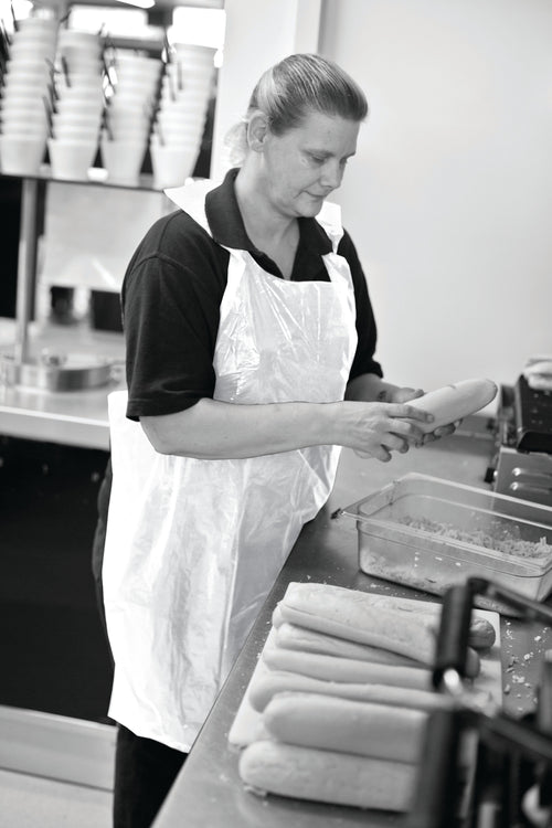 white dispsable aprons blue