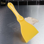 yellow plastic hand scraper